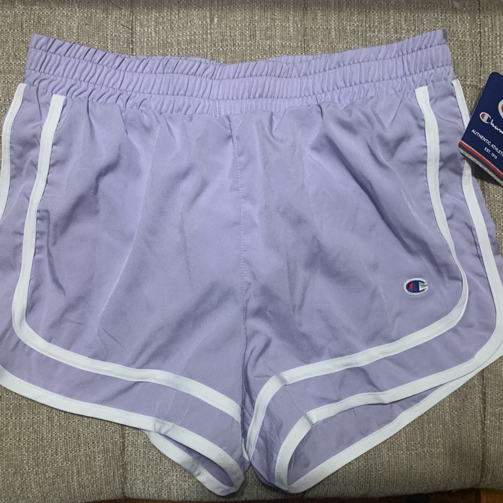 Brand New with tags!! Champion dolphin running shorts. Light purple. Size L